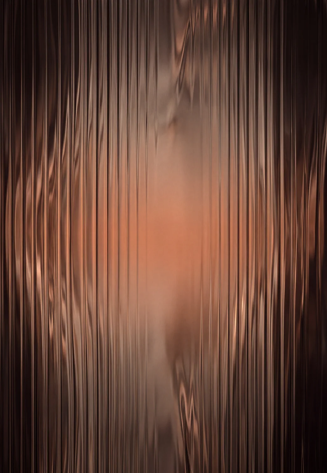 Abstract dark bronze artwork with vertical glass-like reflections